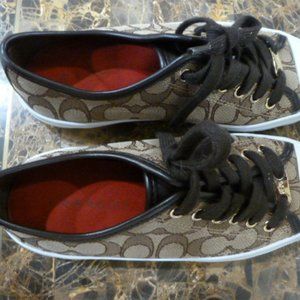 Brown and white Coach athletic shoes